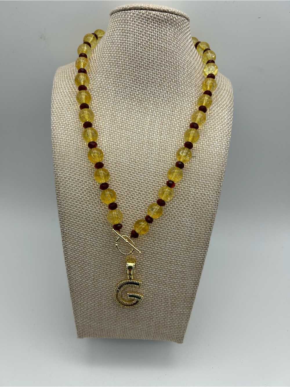 Gold-Tone Initial 'G' Pendant Necklace with Yellow and Brown Beads